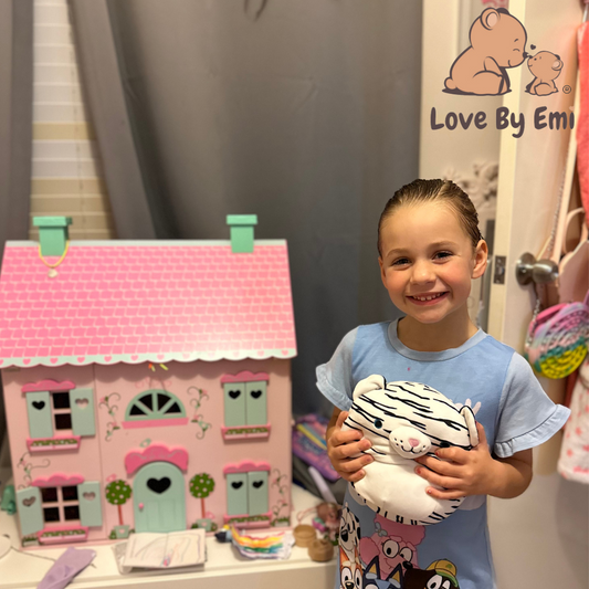 Product image of beautiful white tiger squishy made by love by emi held by cute girl looking so happy with her new toy